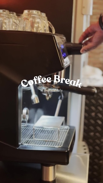 A close-up, high-quality video-style shot of a user operating an espresso machine to prepare a drink, capturing the essence of a daily coffee break.