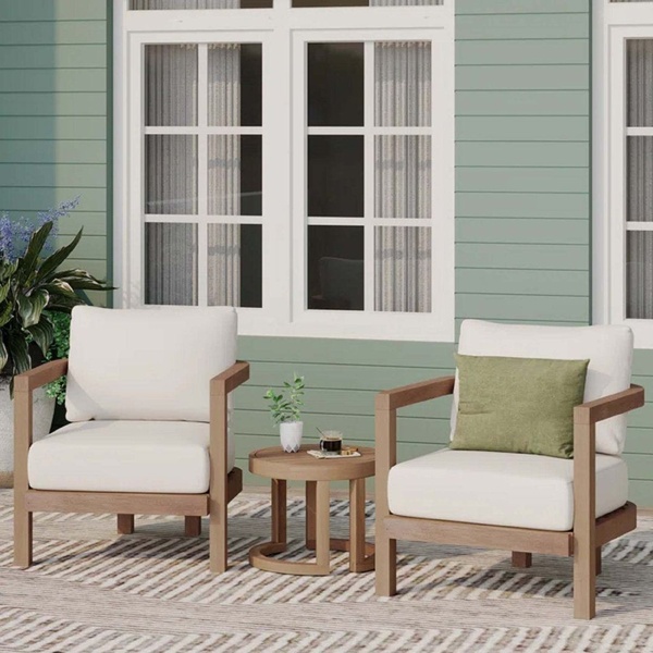 A high-quality lifestyle shot featuring two outdoor patio chairs and a matching side table in a bright, clean, outdoor setting.