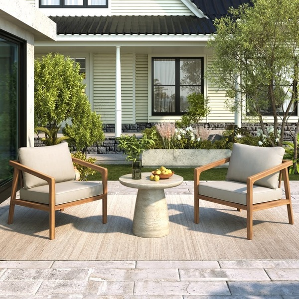 A high-end 1:1 image featuring two modern wooden patio chairs and a round stone table on a sunny backyard patio.