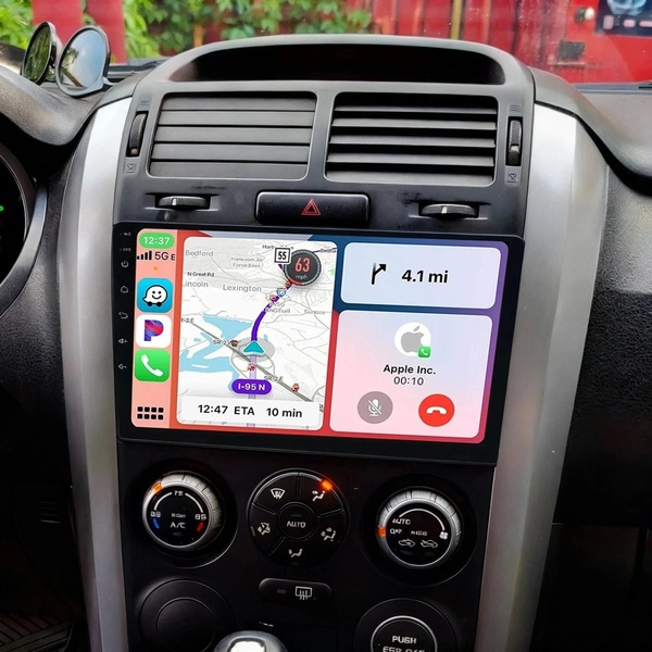 A high-clarity capture of an aftermarket car infotainment system displaying a real-time navigation map and integrated phone calling interface.
