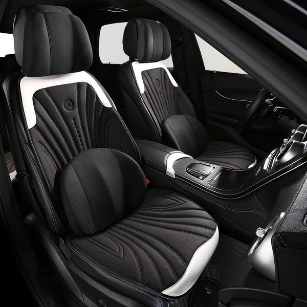 A high-contrast hero shot of a premium car seat cover installed in a luxury vehicle. The image highlights the texture, padding, and sleek monochrome design of the automotive interior accessory.