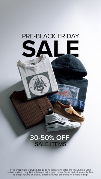 A high-contrast, vertical sale creative featuring a layered stack of apparel and footwear, focusing on a clear, text-driven promotional offer.