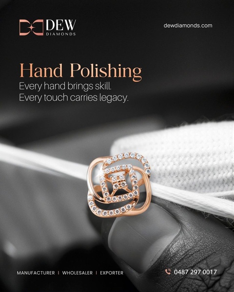 This creative features a close-up macro shot of a diamond ring held by a craftsman's hand, emphasizing the meticulous skill behind jewelry manufacturing.