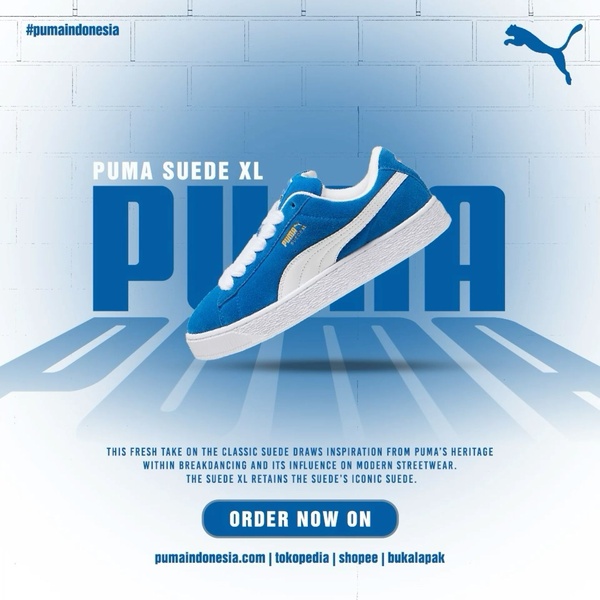 A clean, studio-lit presentation of the Suede XL sneaker using a blue-on-white high contrast aesthetic to drive brand recognition and product focus.