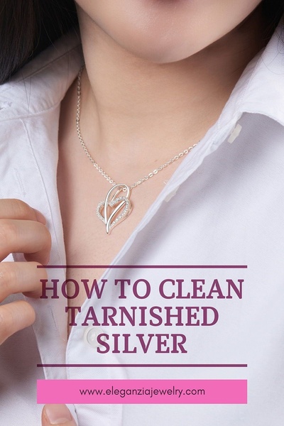 An instructional close-up shot showing a woman wearing a silver heart necklace, overlayed with a clear, benefit-driven text hook.