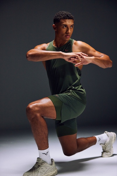 tank top, athletic shorts, workout clothing, exercise apparel, activewear set, product demo, minimalist, lifestyle, bold, energetic, green, neutral