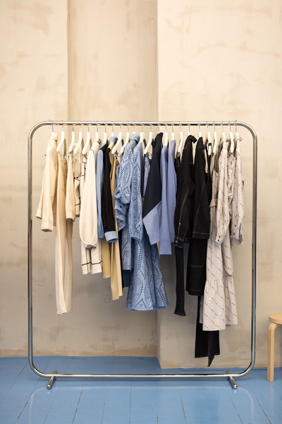 clothing rack, garment rack, display rack, clothing display, retail clothing rack, new arrival, minimalist, calm, trustworthy, neutral