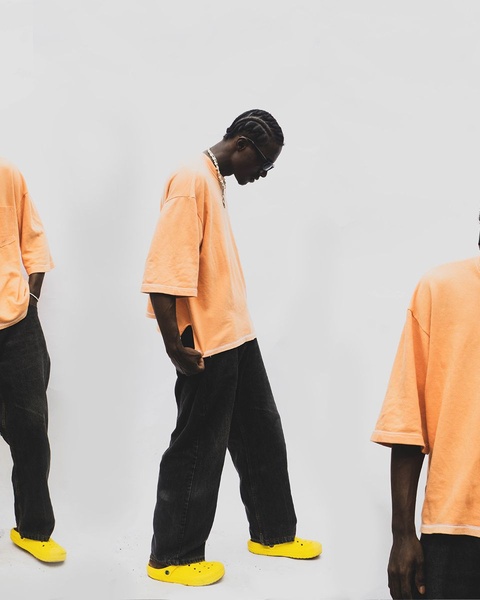 t-shirt, oversized tee, cotton t-shirt, casual tee, short sleeve shirt, brand awareness, minimalist, editorial, energetic, bold, neutral, yellow, orange