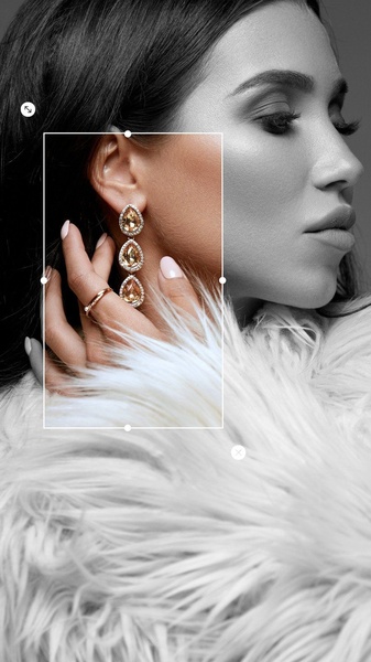 A close-up aesthetic shot highlighting gold-toned teardrop earrings against a monochrome model background, emphasizing material texture and luxury.