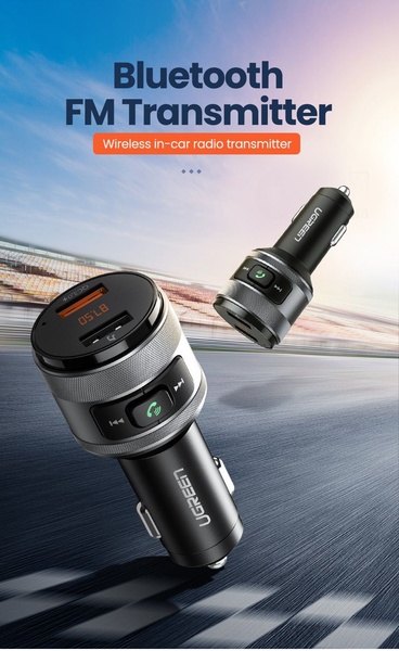 A high-contrast, professional product hero shot showing a Bluetooth FM transmitter against a dynamic racetrack background, emphasizing a high-tech and fast-paced aesthetic.