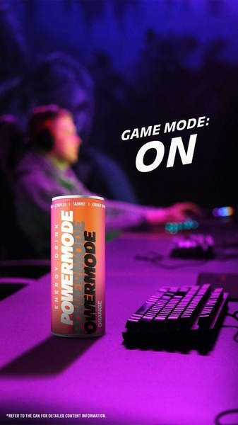 A vertical lifestyle shot featuring an energy drink can on a desk in a dark, neon-purple lit gaming room with the headline Game Mode: ON.