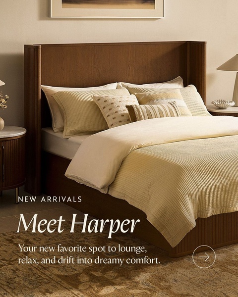 A high-end lifestyle shot of a modern upholstered bed featuring soft, neutral tones and minimal, aspirational copy.