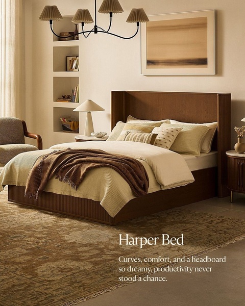 A high-end bedroom scene featuring a dark wood Harper Bed, neutral textiles, and ambient lighting, emphasizing a peaceful, luxury aesthetic.
