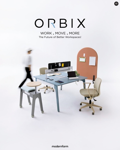 A clean, studio-lit photograph of a modular office desk system with soft color accents, designed to convey a feeling of professional, movement-focused work.