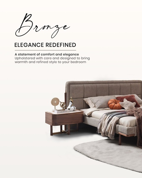 A high-end studio shot of an upholstered bed and wood nightstand, using clean white space and elegant serif typography.