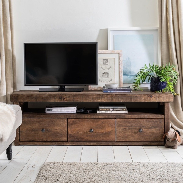 A high-quality lifestyle shot featuring a rustic wooden media console styled in a warm, inviting living room setting to showcase home decor appeal.