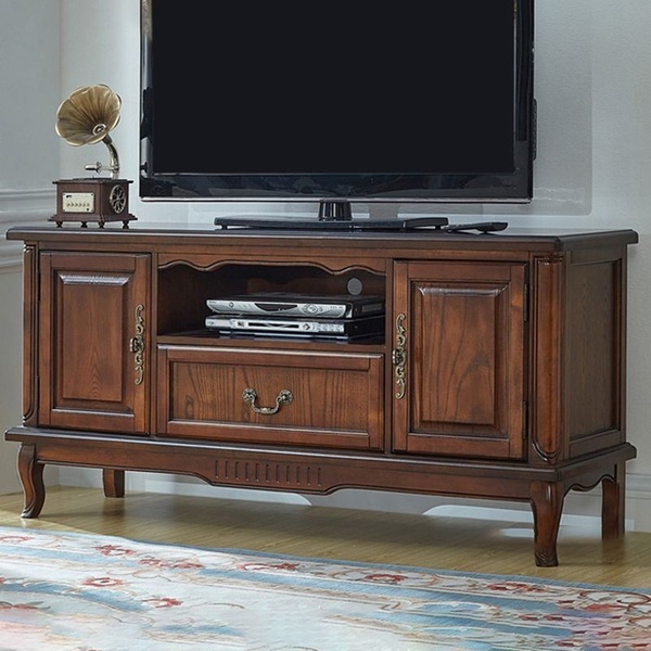 A high-quality, static hero shot of a dark wood Media Console positioned in a clean, minimalist home environment.