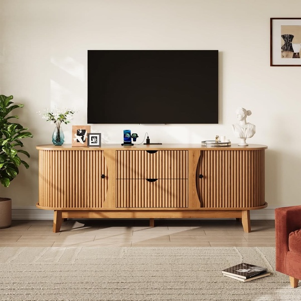 A high-quality, studio-lit photograph of a slatted-door media console staged in a clean, minimalist living room environment.