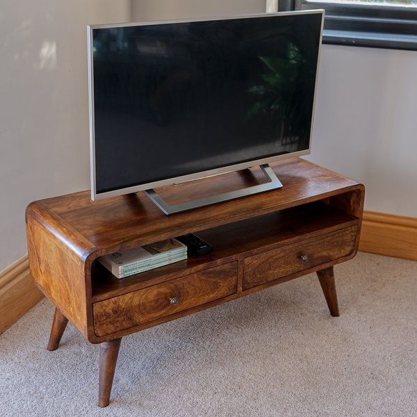 A clean, eye-level lifestyle shot of a wooden TV stand with a TV, highlighting a warm, natural wood finish and minimalist home staging.
