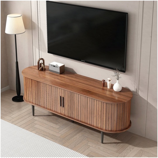A high-end media console displayed in a clean, sunlit room, focusing on its rounded wood texture and modern aesthetic.