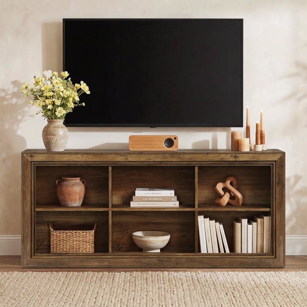 A high-end media console featuring natural wood textures styled with curated decor to evoke a premium, aspirational living space.