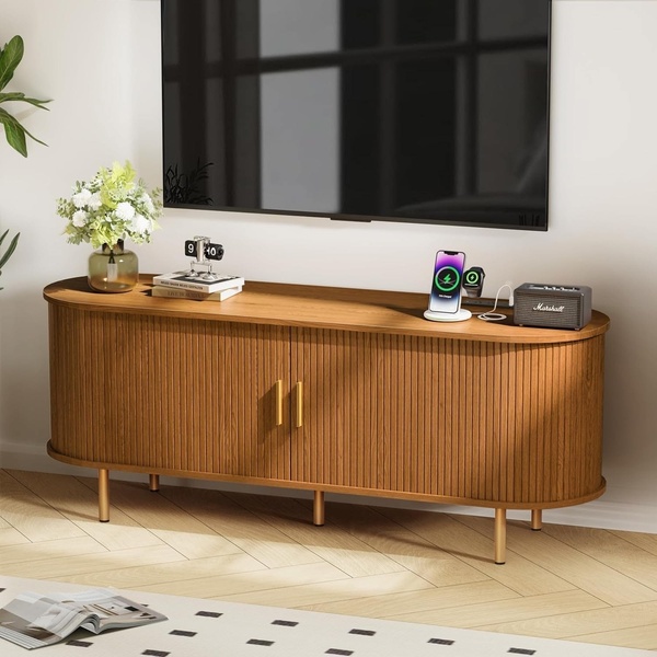 A high-end, clean product hero shot of a wooden TV media console staged in a modern, minimalist living room.
