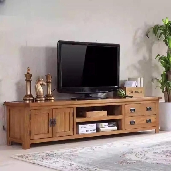 A high-quality lifestyle shot of a wooden TV console table styled with home decor to demonstrate aesthetic fit.