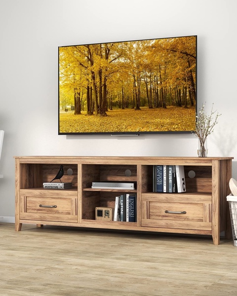 A clean, high-contrast studio-style shot focusing on the warm wood texture of the console and its integration into a modern living space.