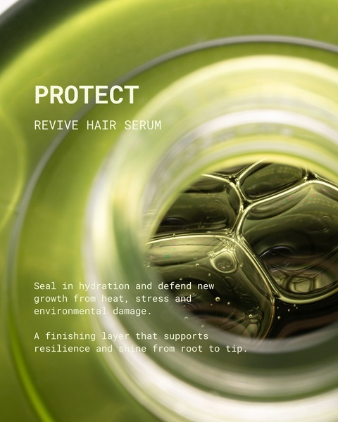 A close-up, macro shot of a green hair serum bottle with visible bubbles, highlighting the product's texture and natural, protective qualities.