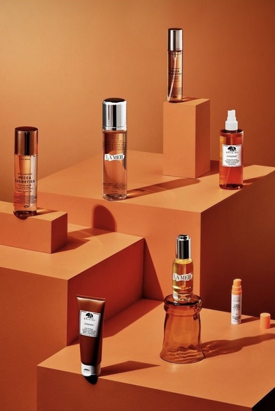 face serum, facial mist, skincare cream, micellar water, skincare bottles, beauty products, brand awareness, bestseller push, minimalist, editorial, luxurious, calm, orange, brown