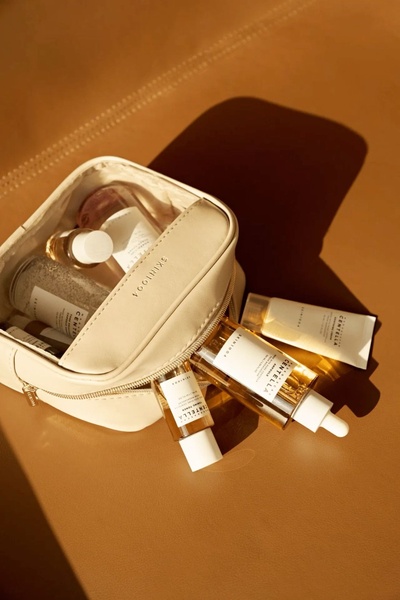 skincare products, facial serum, face toner, skincare set, cosmetic bag, bestseller push, lifestyle, minimalist, calm, luxurious, neutral, brown