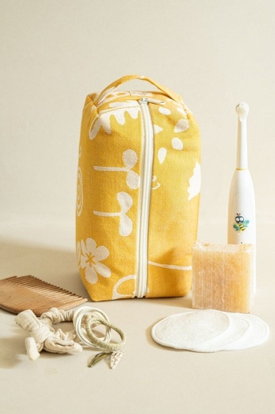 toiletry bag, travel pouch, cosmetic bag, travel organizer, beauty kit, new arrival, minimalist, flat lay, calm, fresh, yellow, neutral