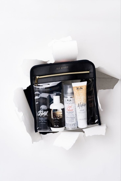 hair care kit, travel makeup bag, hair styling products, hair care set, cosmetic travel bag, new arrival, bestseller push, minimalist, flat lay, calm, trustworthy, neutral, black