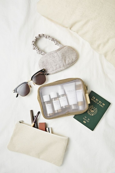 travel skincare kit, toiletry bag, travel cosmetics, skincare minis, travel toiletry set, new arrival, flat lay, minimalist, calm, fresh, neutral