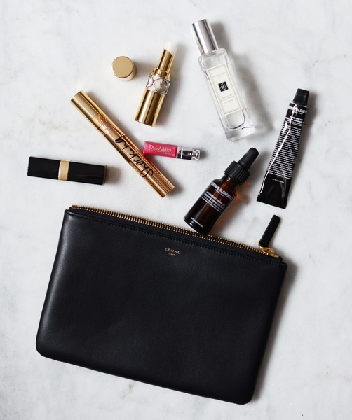 makeup pouch, leather clutch, cosmetic bag, toiletries bag, makeup organizer, bestseller push, flat lay, minimalist, luxurious, calm, neutral, black