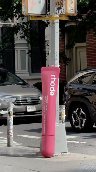 A high-impact, oversized product replica placed in an urban street setting to create immediate visual intrigue and brand recognition.