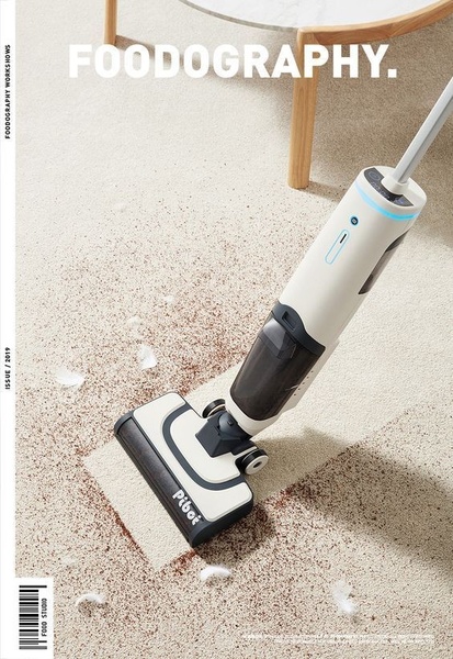 A high-end Floor Vacuum is shown cleaning a messy carpet, creating a clear visual divide between the dirty floor and the clean, vacuumed path.