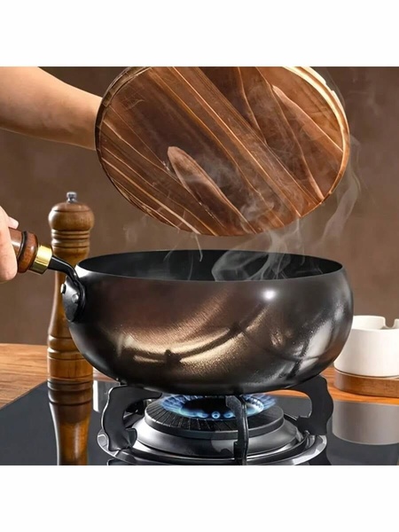 A high-contrast, sensory-focused close-up of a premium wok being uncovered, capturing the steam release on a stovetop.
