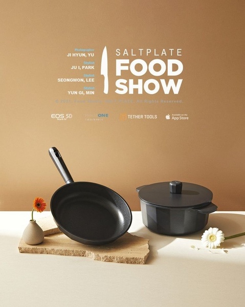 This professional cookware ad creative utilizes clean studio lighting and minimalist staging to position the skillet and pot as premium kitchen essentials.