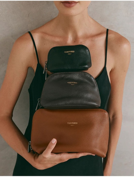 cosmetic pouch, toiletry bag, leather pouch, makeup bag, toiletry case, product demo, lifestyle, luxurious, calm, brown, neutral
