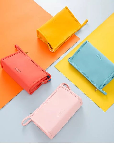 toiletry bag, cosmetic pouch, travel makeup bag, zippered pouch, toiletry organizer, new arrival, bestseller push, minimalist, flat lay, playful, fresh, pink, yellow, orange