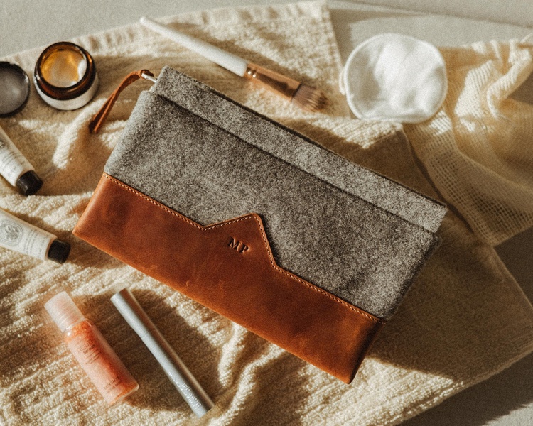 cosmetic bag, toiletry pouch, makeup bag, travel organizer, toiletry case, new arrival, flat lay, lifestyle, calm, trustworthy, neutral, brown