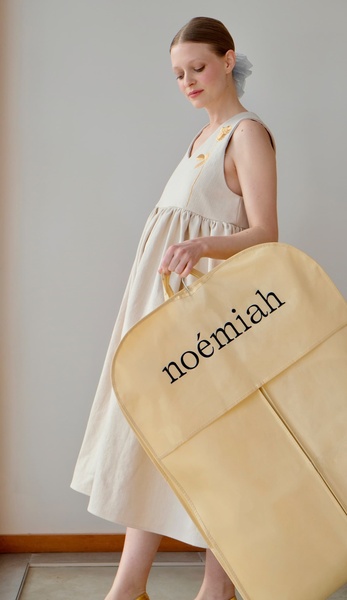 garment bag, clothing cover, dress bag, travel garment bag, storage garment bag, brand awareness, minimalist, editorial, calm, luxurious, neutral