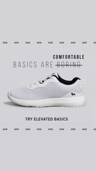 A minimalist, high-contrast vertical ad showing a single running shoe with a strike-through text hook that pivots the messaging toward 'Elevated Basics'.