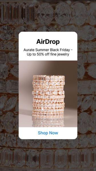 A vertically oriented promotional creative featuring a stack of fine jewelry rings against a neutral background to announce a seasonal sale event.