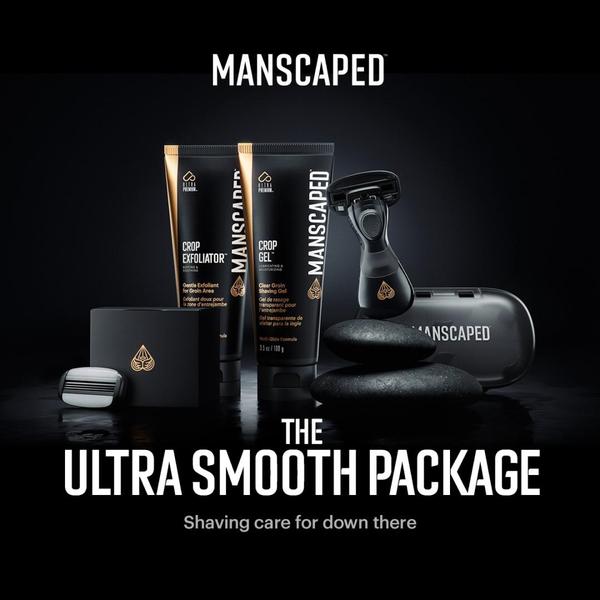 A high-end, studio-lit display of shaving products including exfoliator, gel, a razor, and travel case against a stark black background.