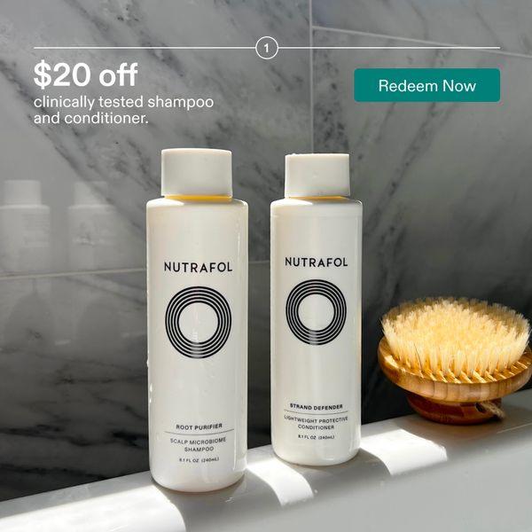 This ad creative features a clean, high-contrast shot of shampoo and conditioner bottles against a marble background, clearly highlighting a $20 discount.