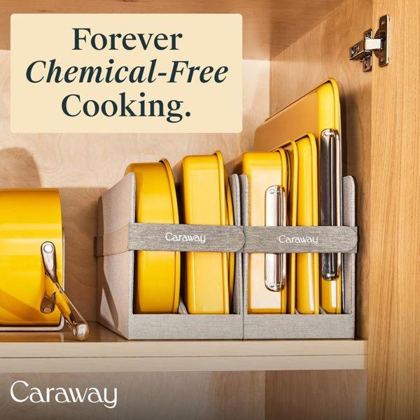 A top-down interior cupboard shot showcasing a organized set of vibrant yellow cookware pieces held in place by brand-labeled organizers.
