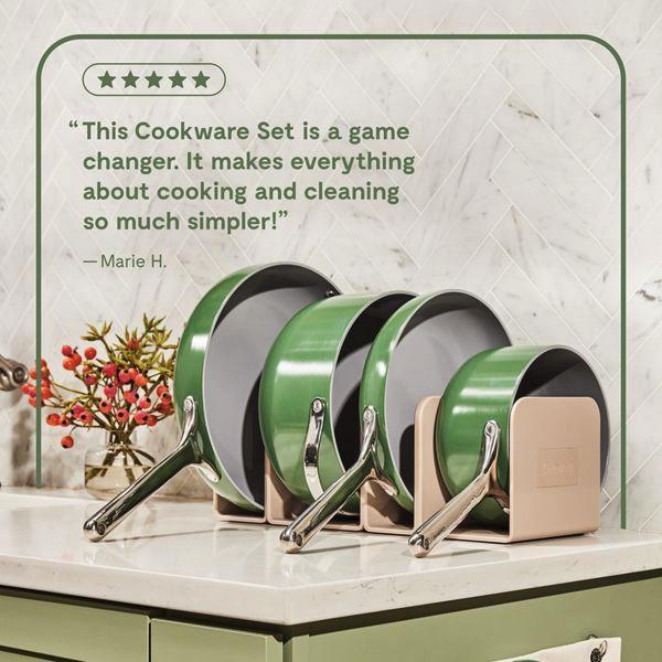 A clean, square-format ad showcasing a cookware set in a modern kitchen with an overlay of a five-star customer review.