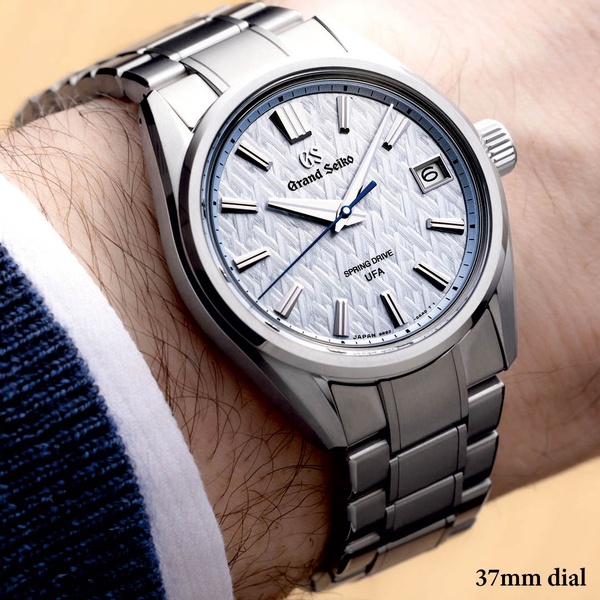 wrist watch, luxury watch, analog watch, metal watch, steel watch, product demo, lifestyle, minimalist, luxurious, calm, neutral, blue